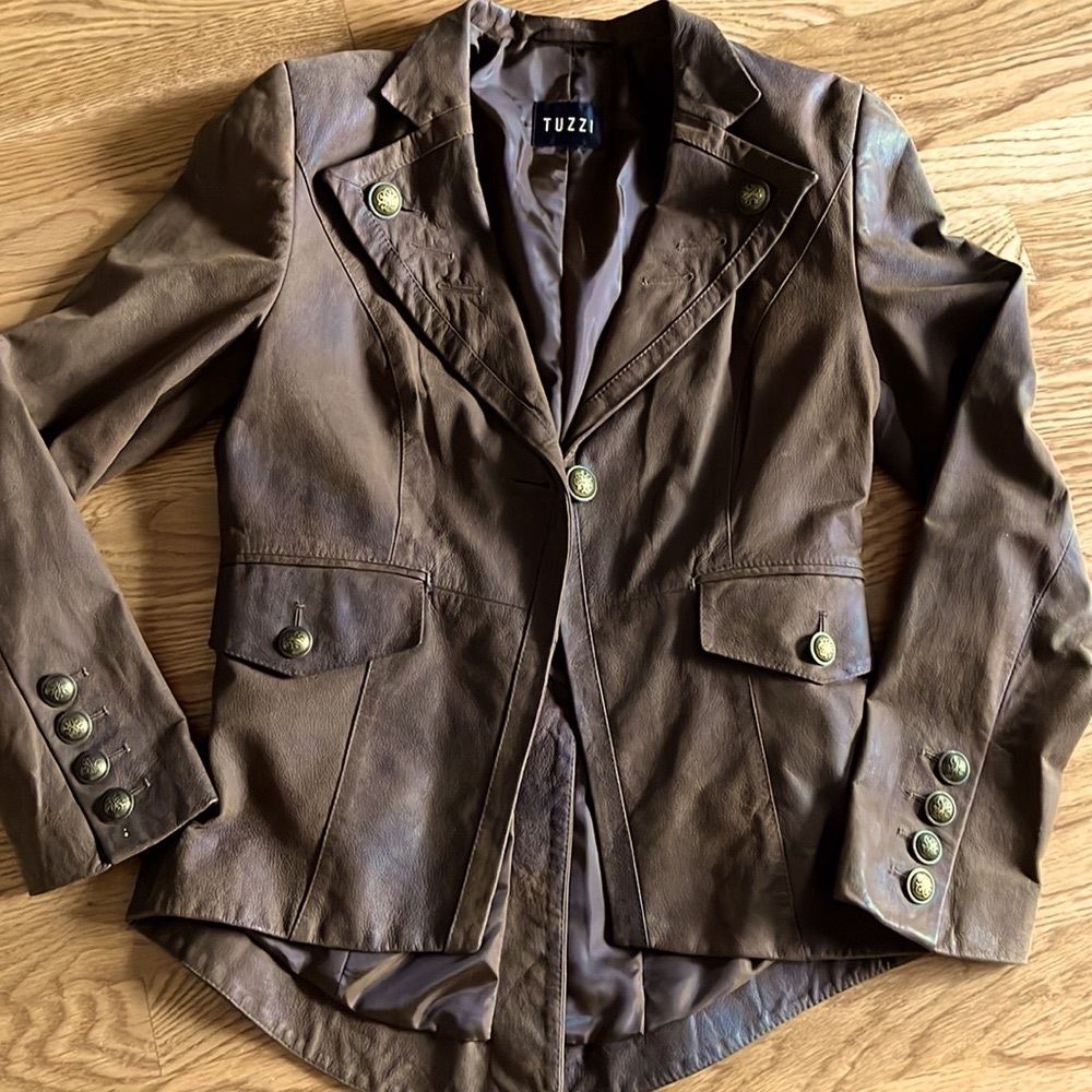 100% Italian Leather fully-lined jacket with brass buttons. New without tags.